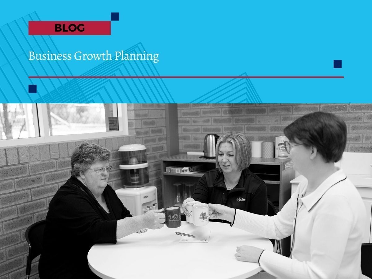 Three businesswomen from First Class Accounts Ovens & Murray sitting together at a table, sharing coffee and discussing business growth planning.