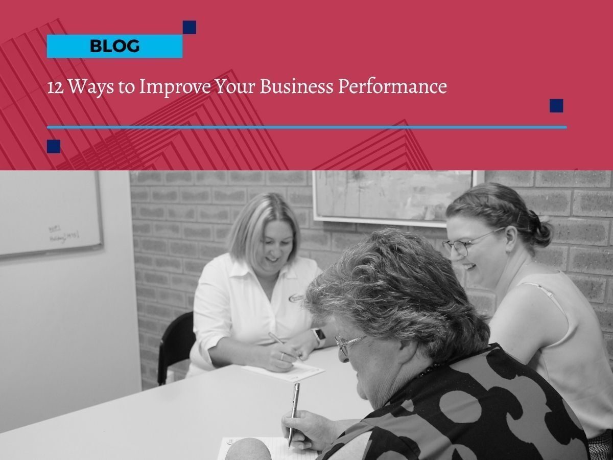 Team from First Class Accounts Ovens & Murray meeting in the office, discussing ways to improve business performance in Albury Wodonga.