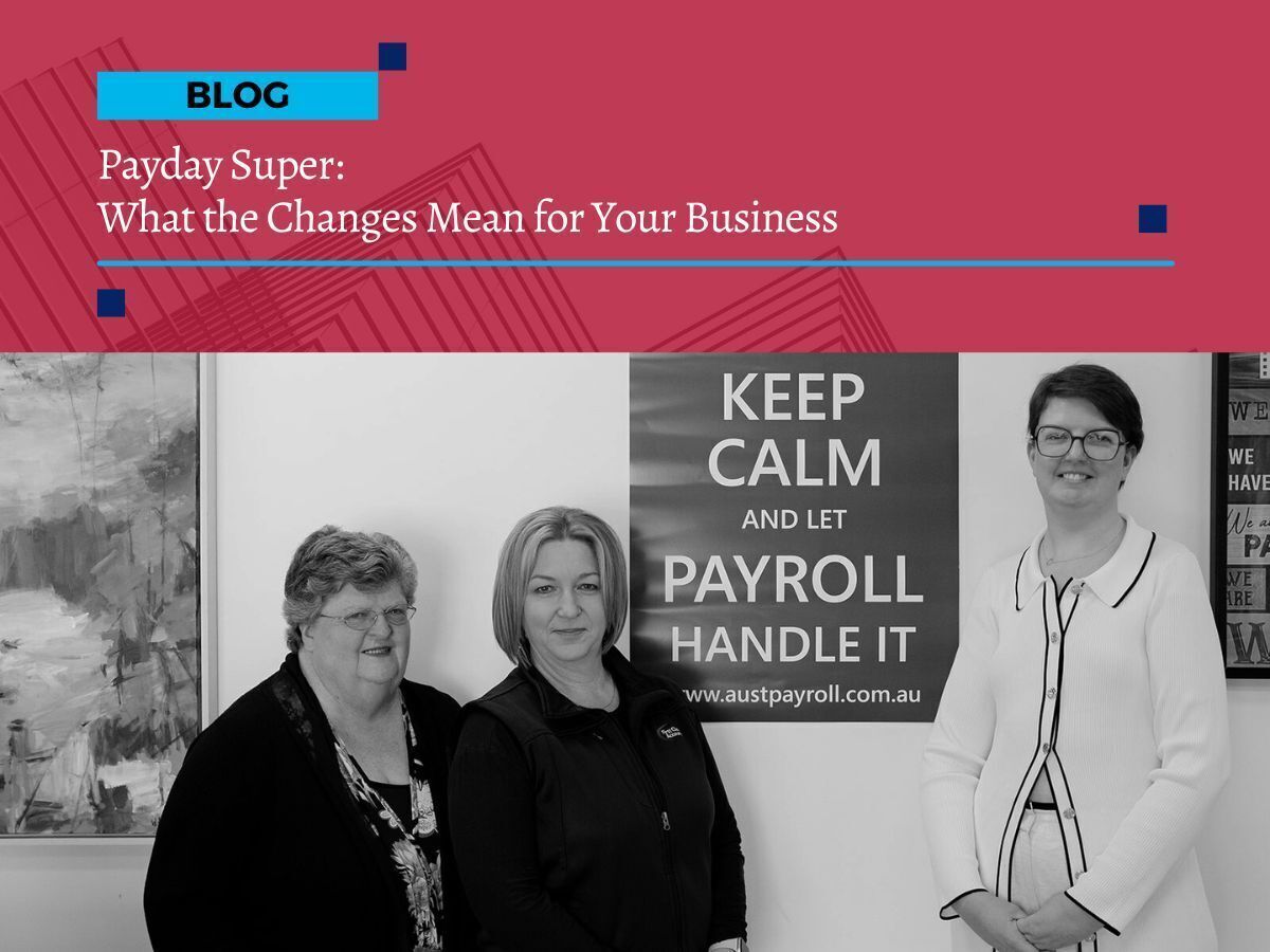 Three team members from First Class Accounts Ovens & Murray standing together beside a poster that reads “Keep Calm and Let Payroll Handle It,” representing their payroll and bookkeeping expertise.