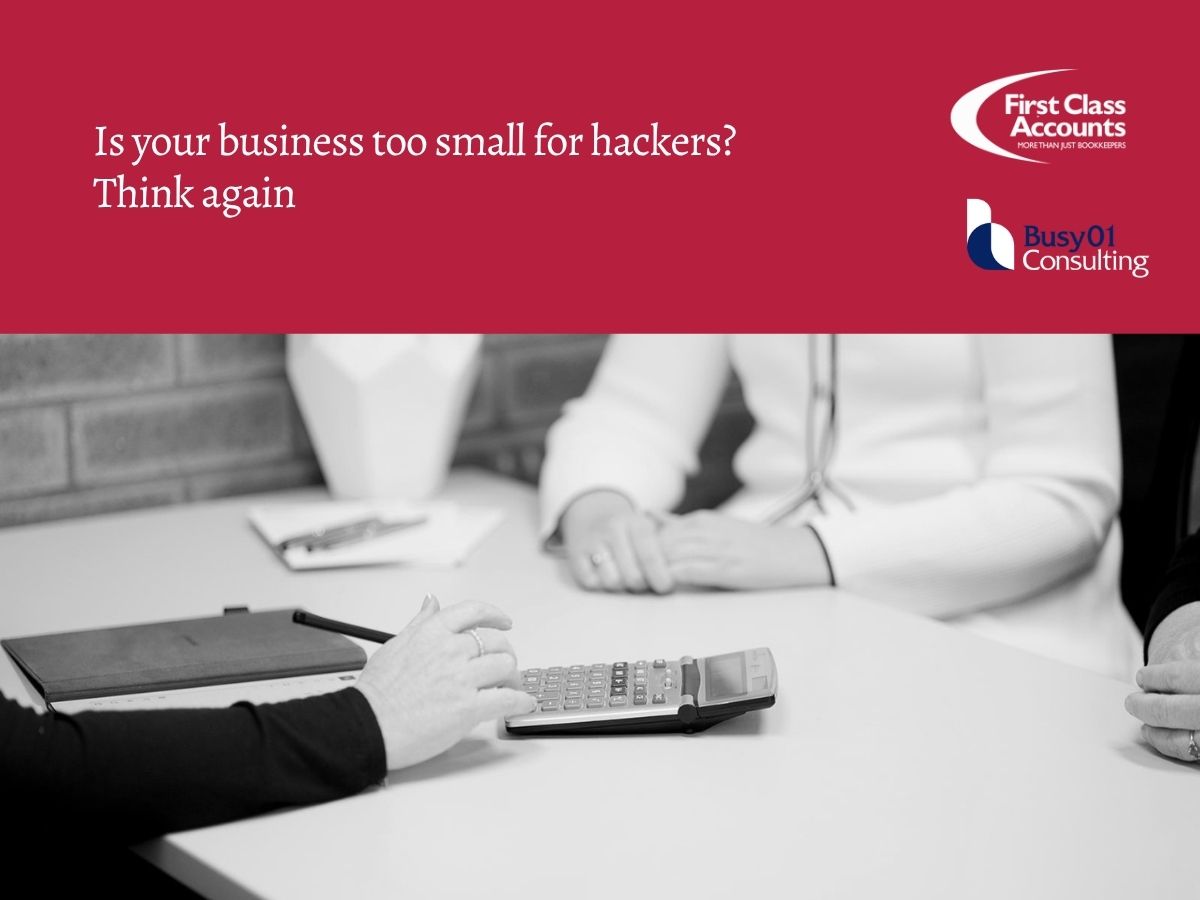 Small business meeting with calculator and paperwork under heading “Is your business too small for hackers? Think again” with First Class Accounts Ovens & Murray branding