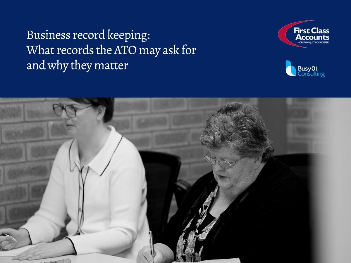 Two First Class Accounts Ovens & Murray team members reviewing business records and paperwork during an office meeting, with the heading “Business record keeping: What records the ATO may ask for and why they matter”.