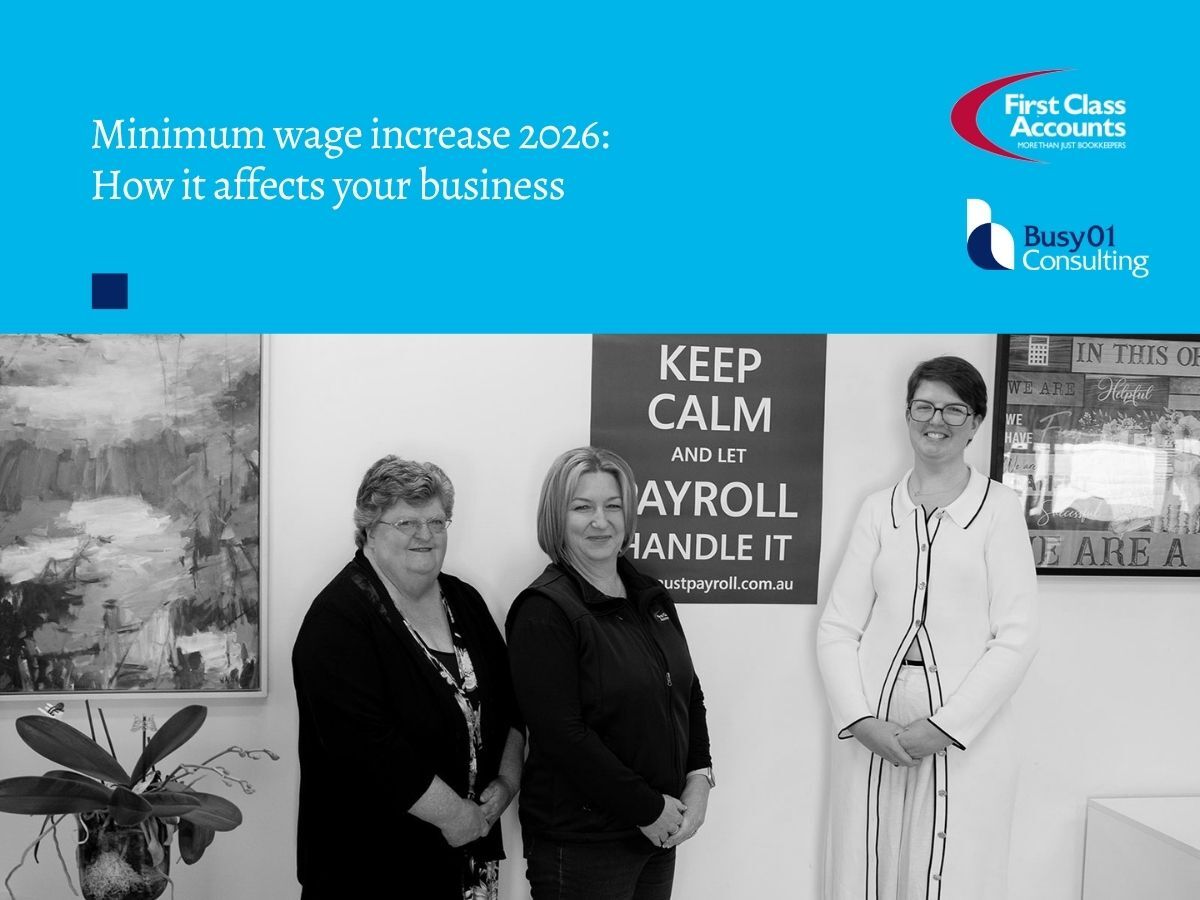 First Class Accounts Ovens & Murray and Busy01 Consulting graphic for the 2026 minimum wage increase, featuring three team members standing in an office beneath the article title.