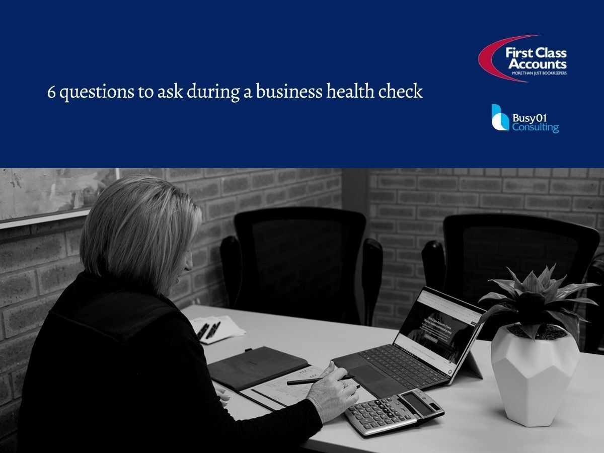 Branded graphic titled “6 questions to ask during a business health check”, with First Class Accounts and Busy01 Consulting logos above Renae reviewing business figures at a meeting table using a calculator, notes and laptop.
